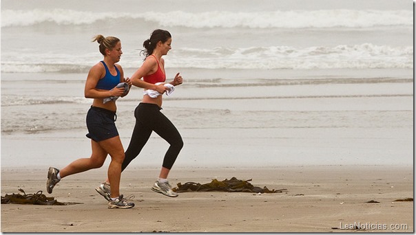 Two female joggers on foggy Morro Strand State Beach