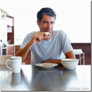4971408-portrait-of-a-happy-mature-man-having-breakfast-at-home