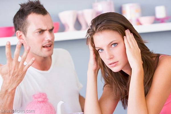 A young couple arguing at the breakfast table