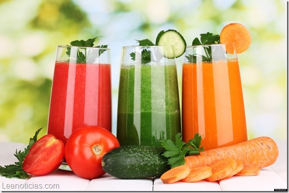 Fresh vegetable juices on wooden table, on green background; Shutterstock ID 122568670; PO: The Huffington Post; Job: The Huffington Post; Client: The Huffington Post; Other: The Huffington Post