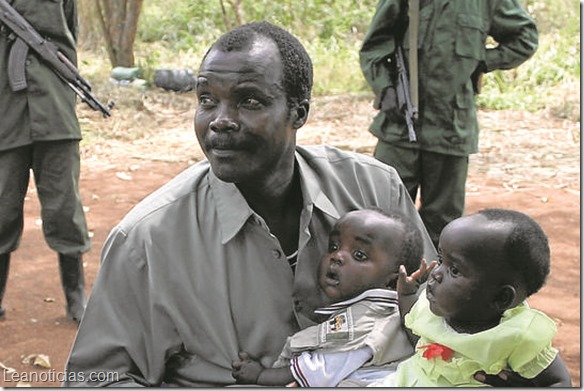 Lord's Resistance Army (LRA) leader Major General Joseph Kony, holds his daughter, Lacot, and son, Opiyo, in this exclusive image, at peace negotiations between the LRA and Ugandan religious and cultural leaders in Ri-Kwangba, southern Sudan ini this November 30, 2008 file photograph. A video calling for the arrest of Joseph Kony, the fugitive leader of the Lord¿s Resistance Army terror group in Uganda, swept through the Internet this week, attracting a wave of support on Twitter as well as a skeptical backlash against a little-known team of filmmakers based in San Diego.      REUTERS/Africa24 Media/Files    (SUDAN - Tags: CIVIL UNREST CONFLICT) NO ONLINE USE. NOT FOR SALE FOR INTERNET DISPLAY. TV OUT.  NOT FOR SALE TO TELEVISION BROADCASTERS