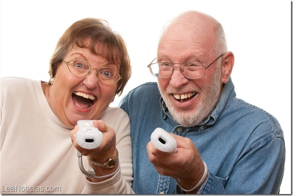 Happy Senior Couple Play Video Game with Remotes