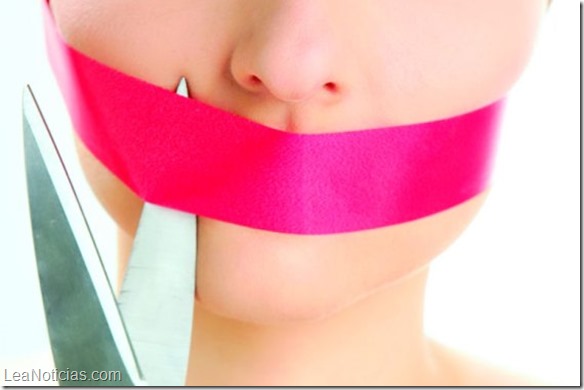 Beautiful woman with red tape on mouth portrait