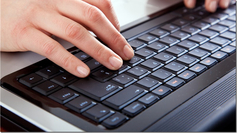 Female hands typing on a laptop; Shutterstock ID 71513038; PO: aol; Job: production; Client: drone