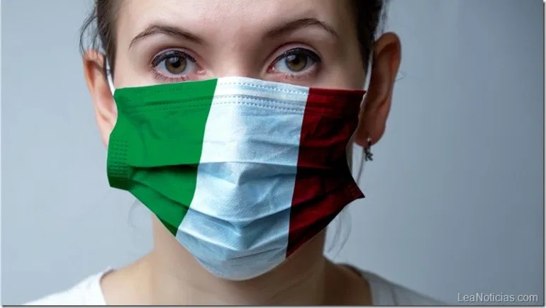 Girl in a medical protective mask. Abstract Italy flag on fabric. Coronovirus Pandemic Concept COVID-19.