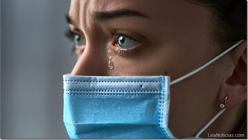 Upset depressed melancholy sad crying woman in protective face mask with tears eyes during serious illness, coronavirus outbreak and flu covid-19 epidemic. Health problems difficulties
