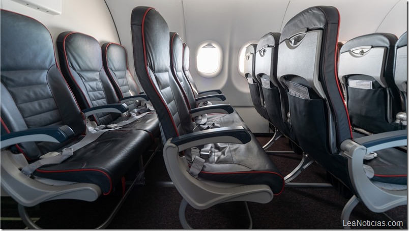 Airplane seats and windows. Economy class comfortable seats without passengers. New low-cost carrier airline